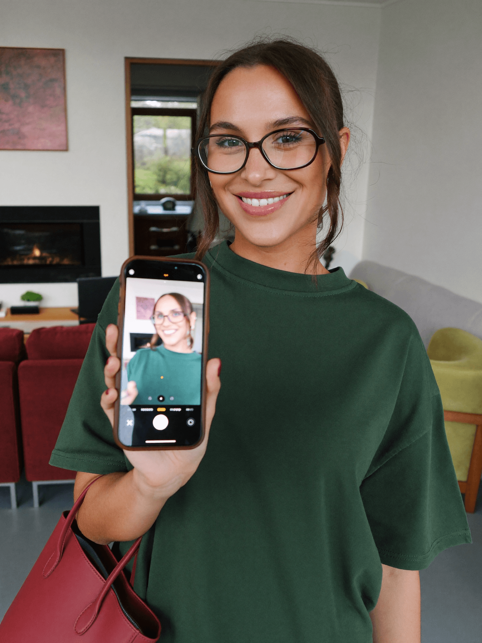 A shopper checking a live virtual eyewear try-on on her phone